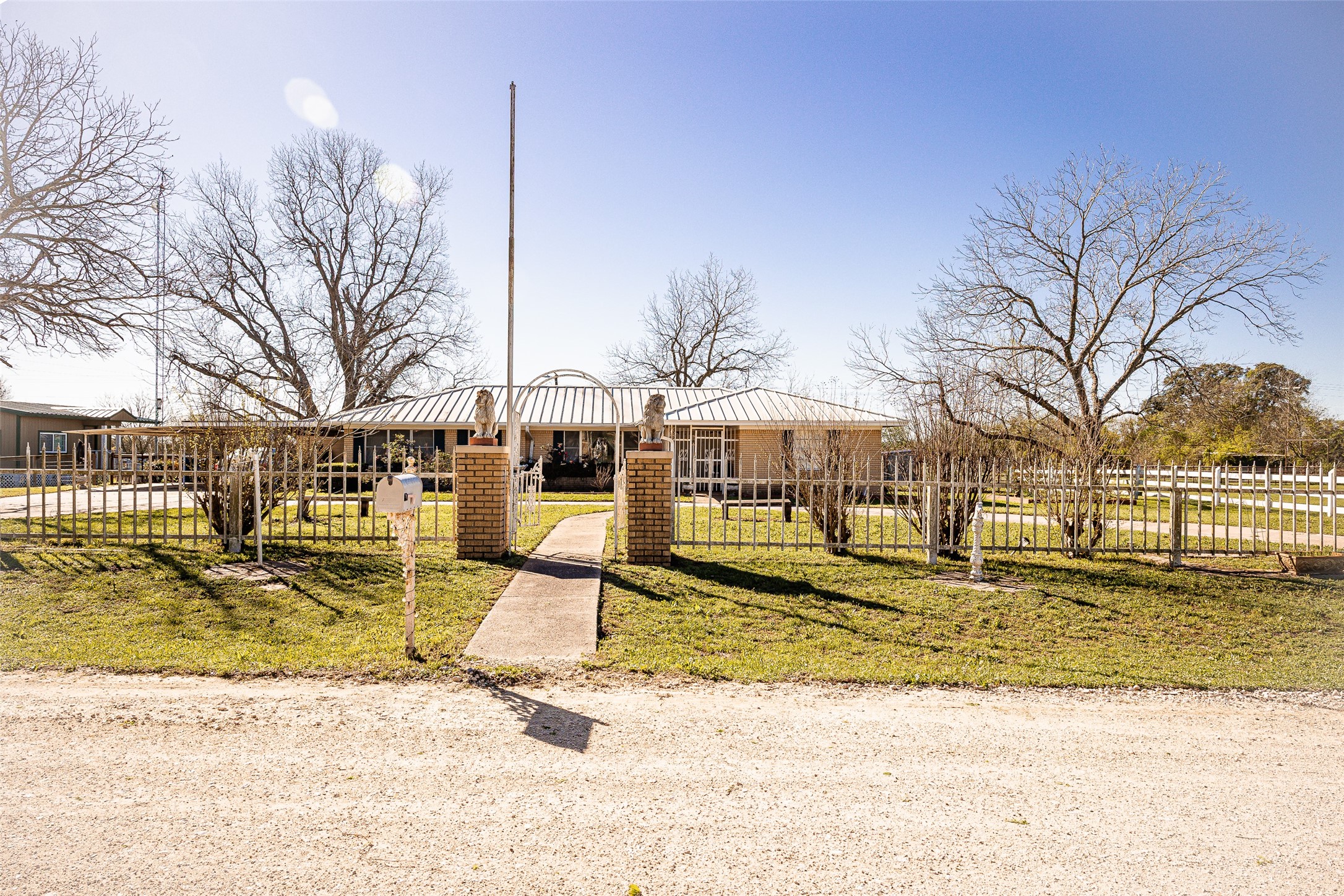 8608 Captain Scott Road Brenham, TX 77833 - Photo 2 of 28 a view of a house with snow on the ground