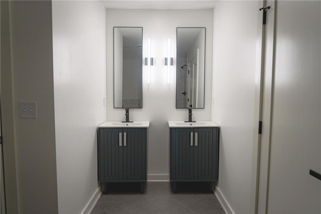 708 Rochelle Drive Southwest Atlanta, GA 30310 - Photo 11 of 24 a bathroom with two sink and a mirror