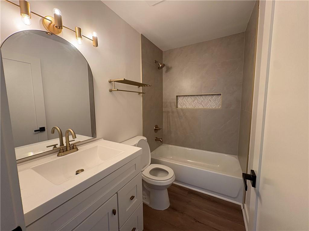 708 Rochelle Drive Southwest Atlanta, GA 30310 - Photo 15 of 24 a bathroom with a sink a toilet and shower