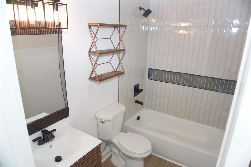 708 Rochelle Drive Southwest Atlanta, GA 30310 - Photo 19 of 24 a bathroom with a sink toilet and shower