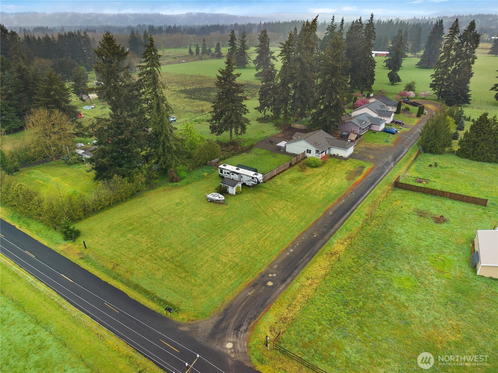 7606 187th Avenue Southwest Rochester, WA 98579 - Photo 27 of 28 a view of a pool with a yard