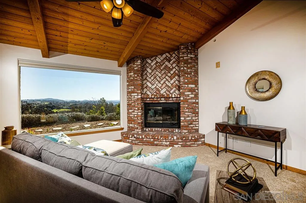 1237 Live Oak Park Road South Fallbrook, CA 92028 - Photo 6 of 25 a living room with furniture and a fireplace