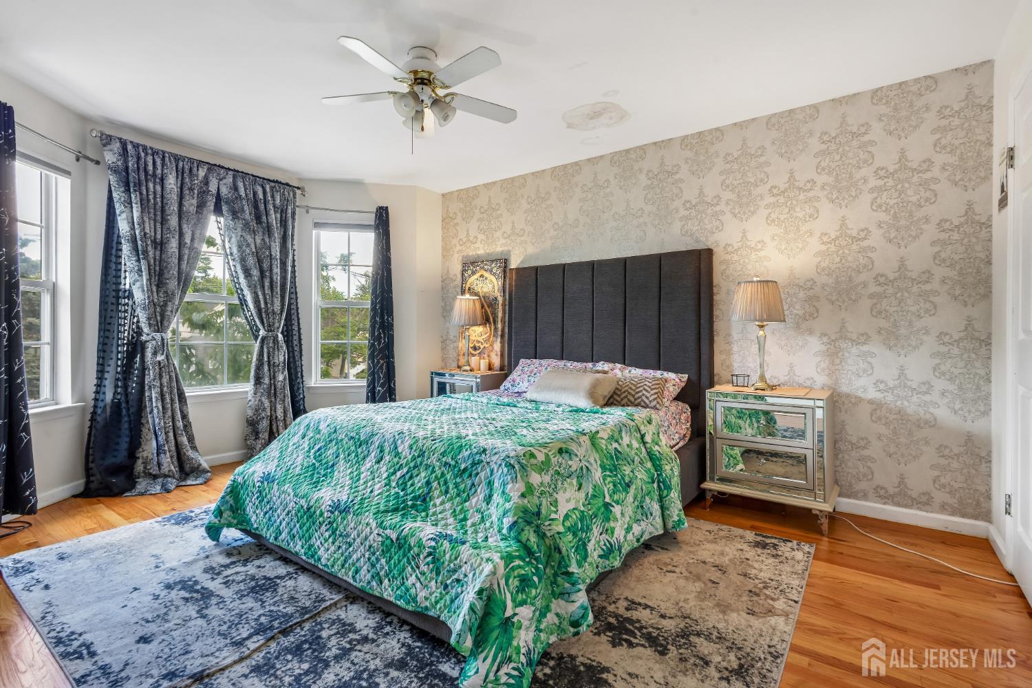 489 Plainfield Road Edison, NJ 08820 - Photo 20 of 39 a bedroom with a bed and a dresser next to a window