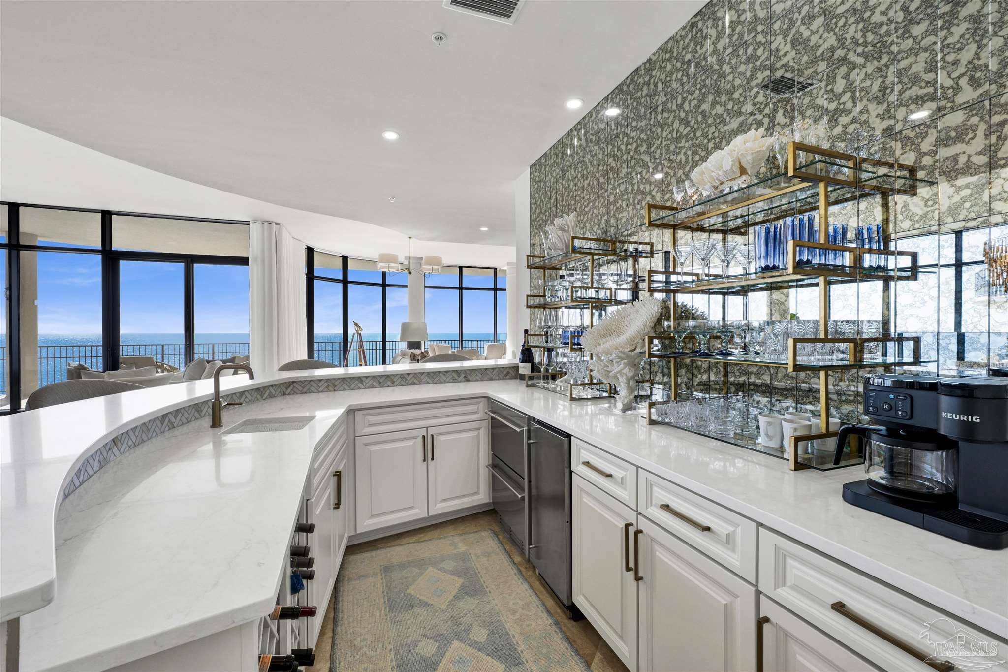 16551 Perdido Key Drive, Unit PH701 Perdido Key, FL 32507 - Photo 12 of 62 a kitchen with counter top space and windows