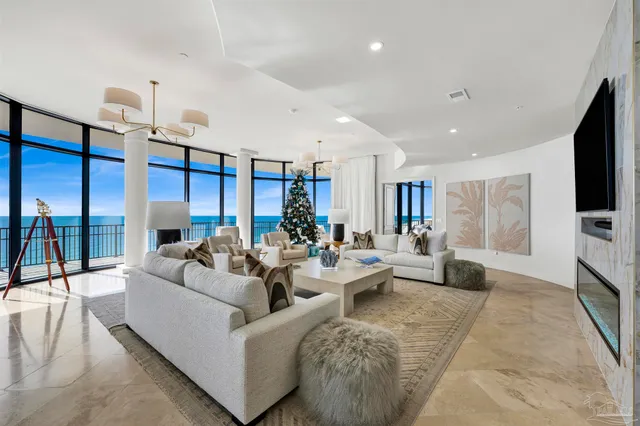 a living room with fireplace furniture and a flat screen tv