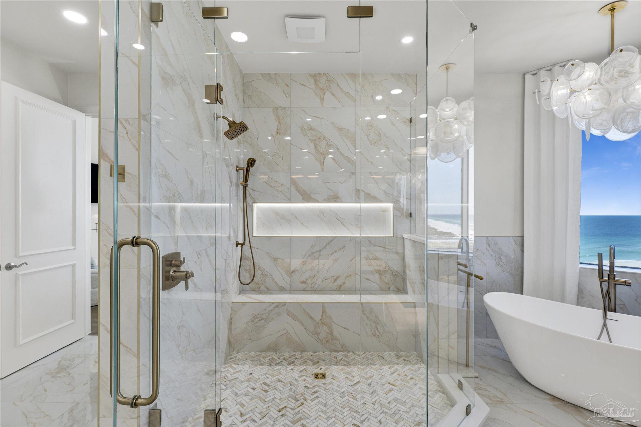 16551 Perdido Key Drive, Unit PH701 Perdido Key, FL 32507 - Photo 34 of 62 a bathroom with a bathtub and shower