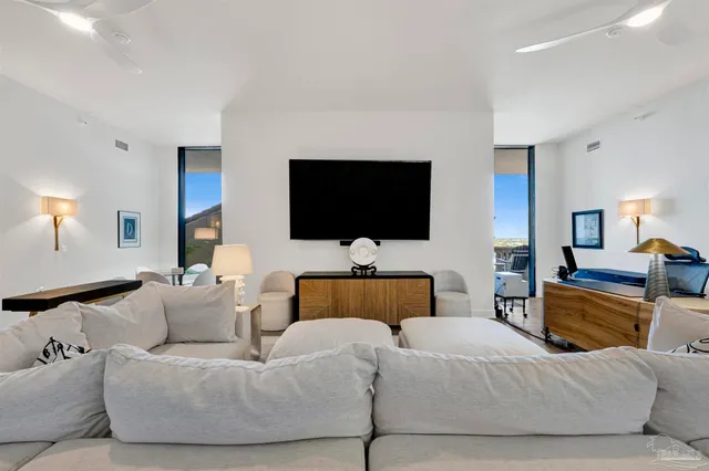 a view of a swimming pool and an outdoor seating