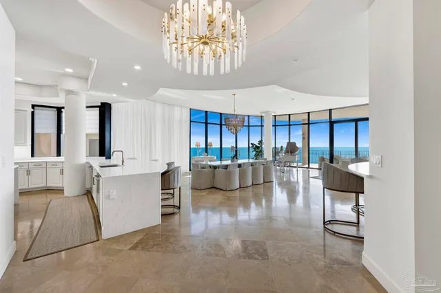 a large kitchen with a table and chairs