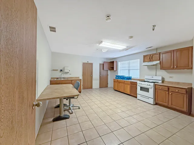 a bedroom with a bed and dresser