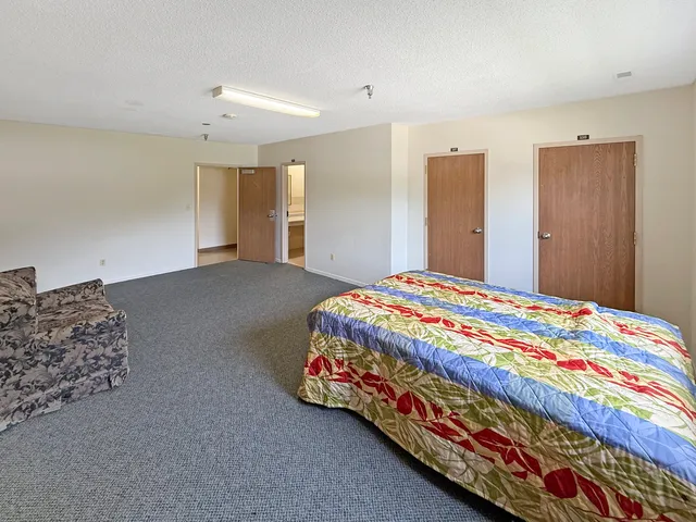 a bed room with a bed and a couch