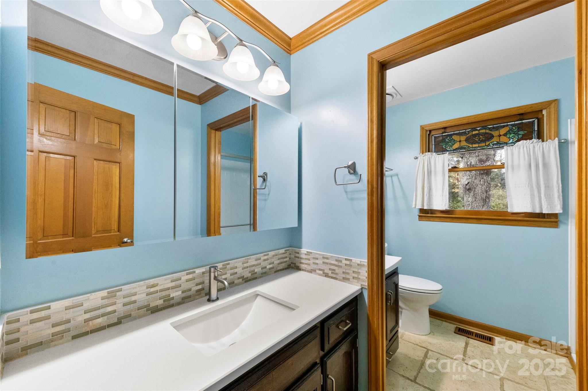 3026 Forbes Road Gastonia, NC 28056 - Photo 25 of 42 a bathroom with a sink and a mirror