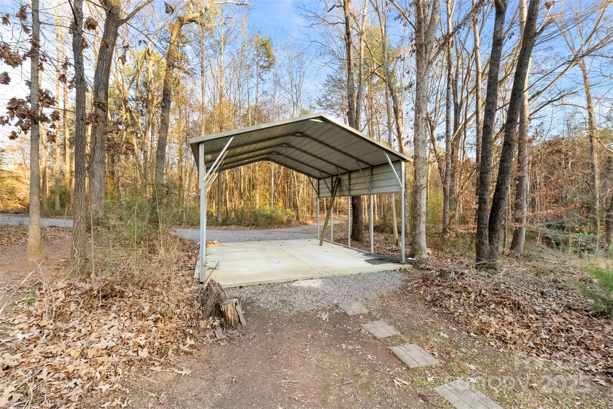 3026 Forbes Road Gastonia, NC 28056 - Photo 34 of 42 a view of a backyard with large trees