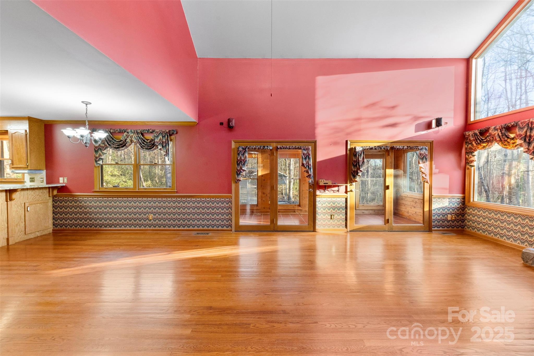 3026 Forbes Road Gastonia, NC 28056 - Photo 6 of 42 a view of an empty room with window and wooden floor