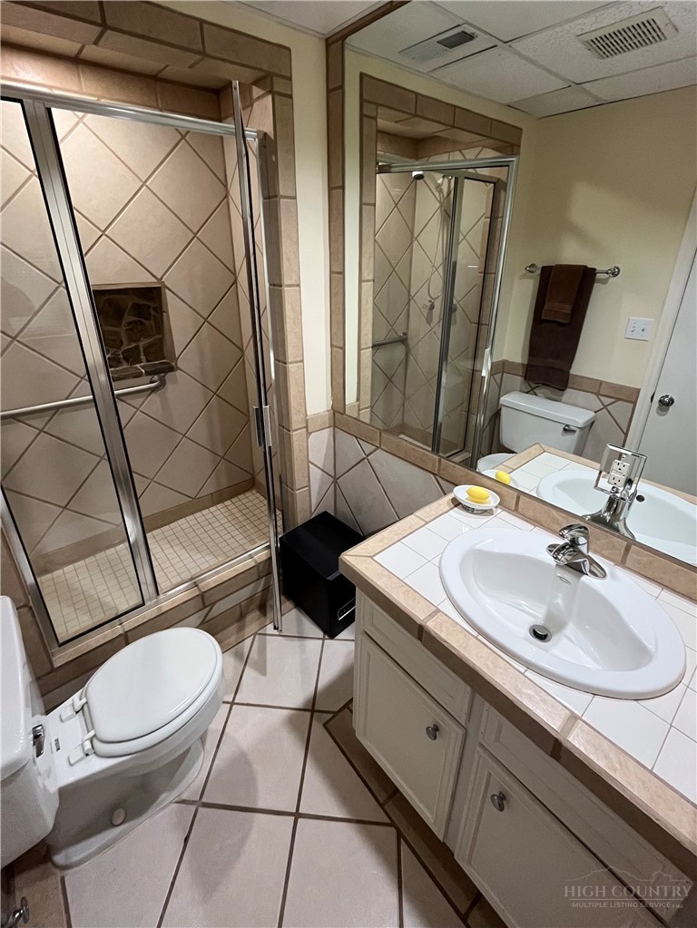 638 Ridge Road Glade Valley, NC 28627 - Photo 21 of 44 a bathroom with a sink and a mirror