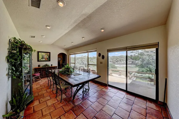 a dining room with furniture and window