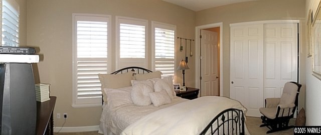2630 Friesian Court Reno, NV 89521 - Photo 3 of 9 a bedroom with a bed and a window
