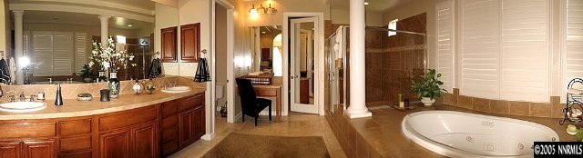 2630 Friesian Court Reno, NV 89521 - Photo 7 of 9 a en suite bathroom with a double vanity sink a mirror and shower