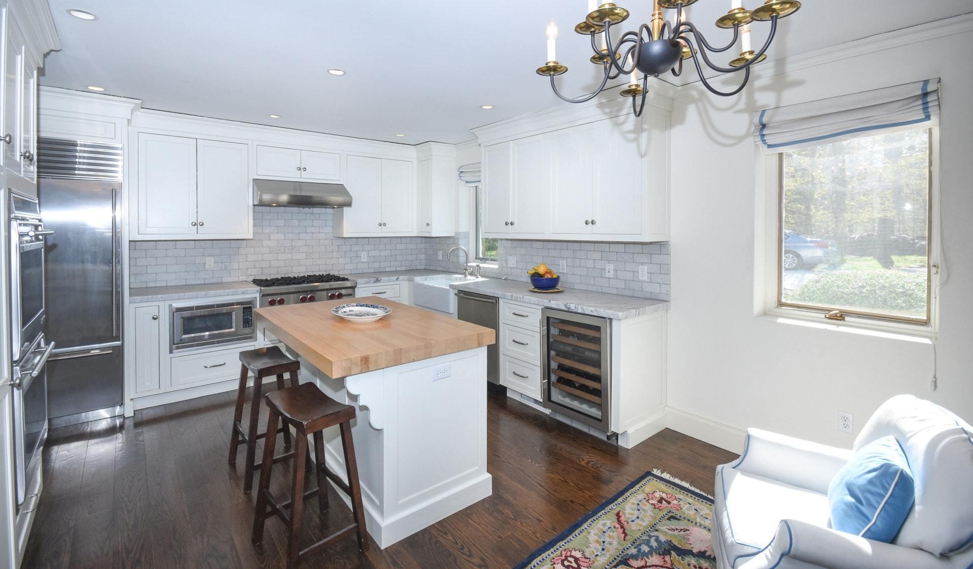 446 Hollow Tree Ridge Road, Unit 4 Darien, CT 06820 - Photo 23 of 37 a kitchen with stainless steel appliances granite countertop a hardwood floor sink and window