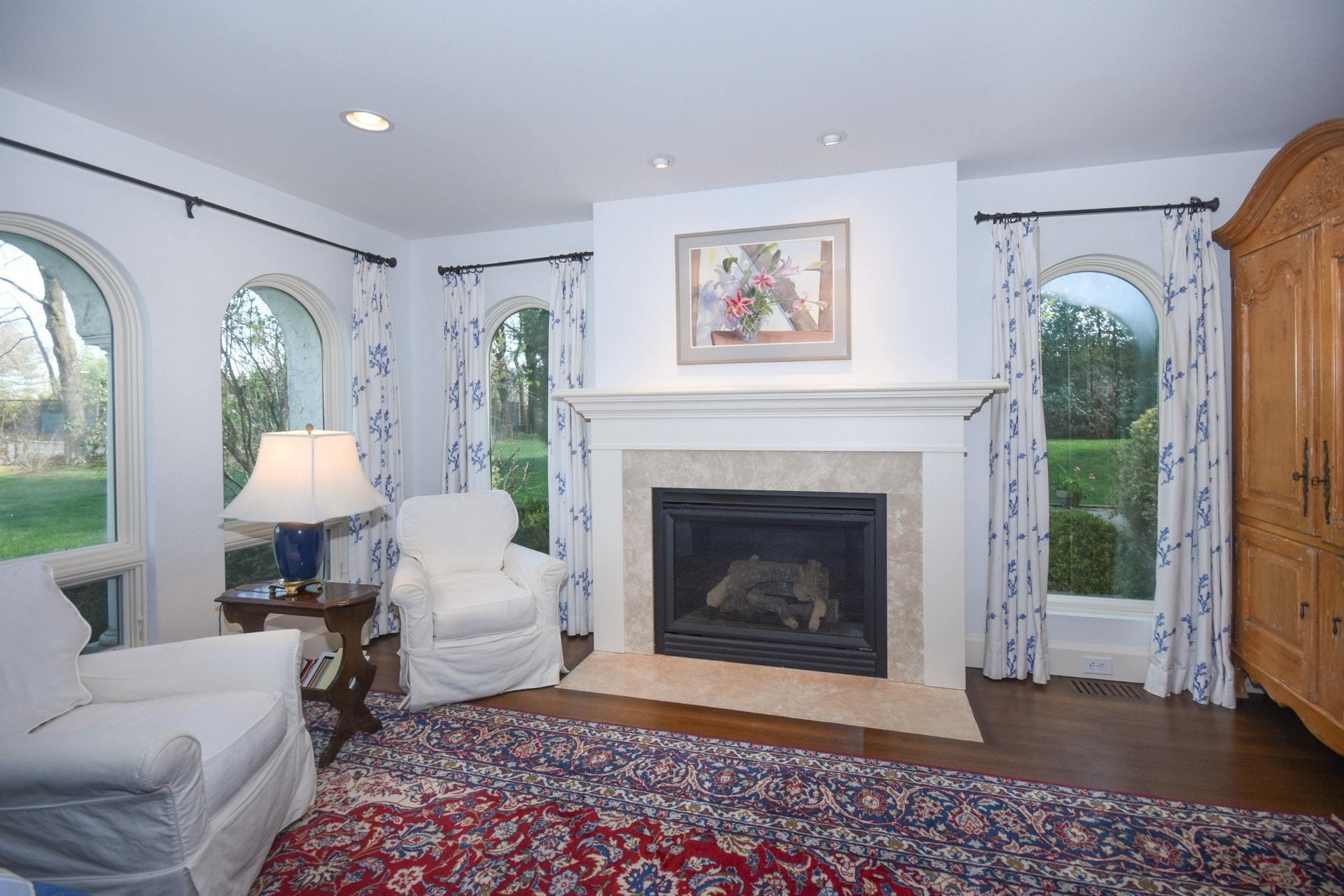 446 Hollow Tree Ridge Road, Unit 4 Darien, CT 06820 - Photo 28 of 37 a living room with furniture and a fireplace