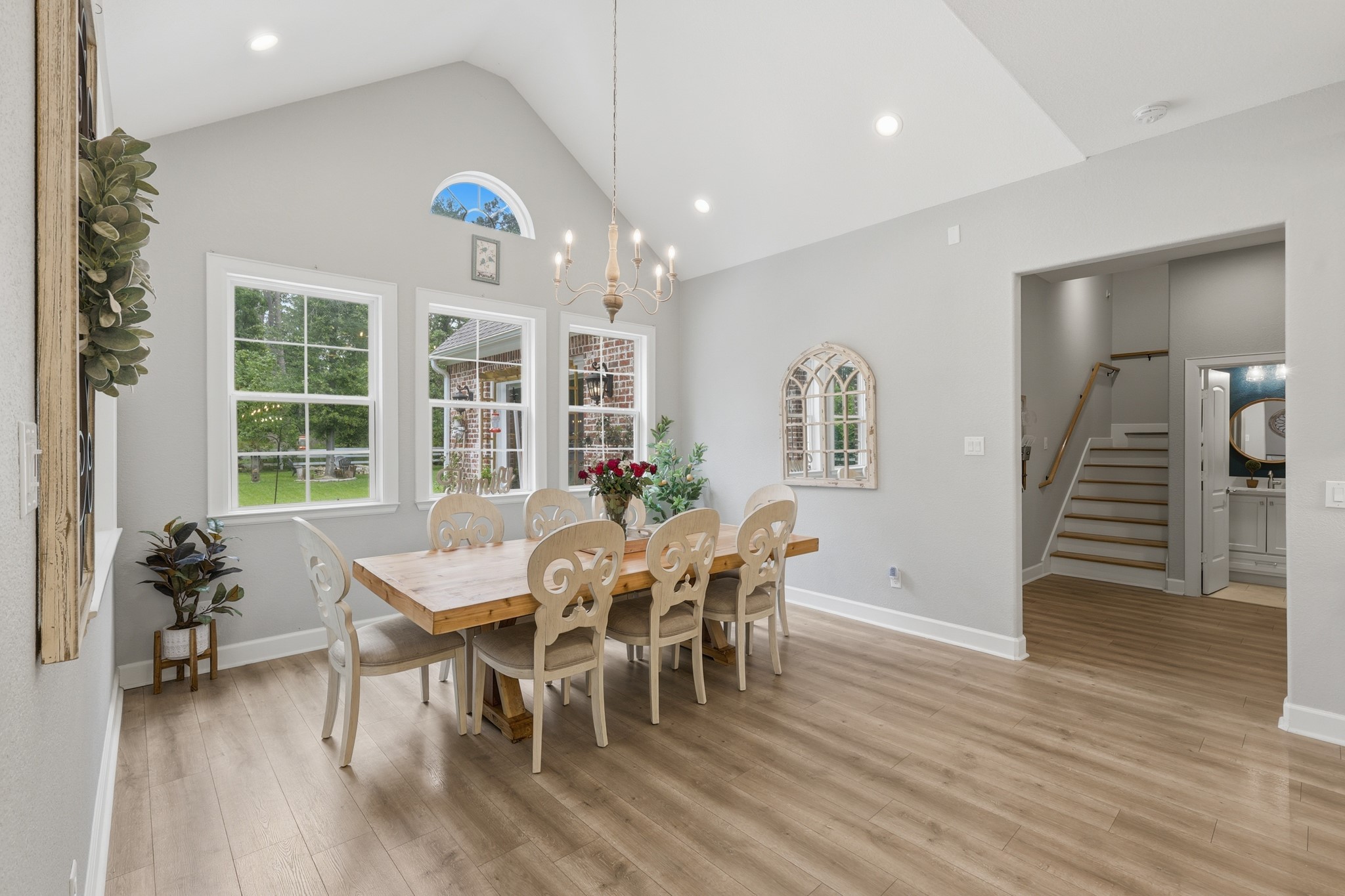 7106 Hampton Court Spring, TX 77389 - Photo 7 of 31 Bright dining area with large windows offer natural light and a view of the greenery outside.