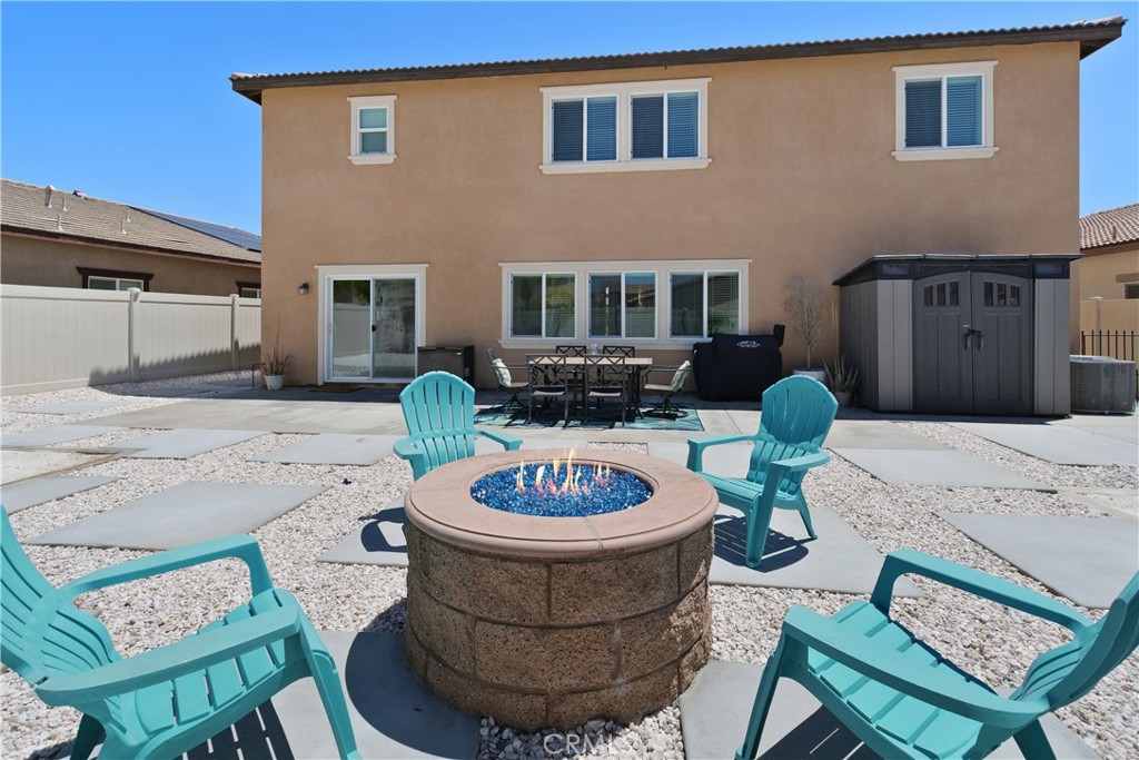 34727 Ribbon Grass Way Murrieta, CA 92563 - Photo 28 of 54 Oversized backyard featuring a firepit—perfect for outdoor entertaining, relaxing evenings, and gathering under the stars.
