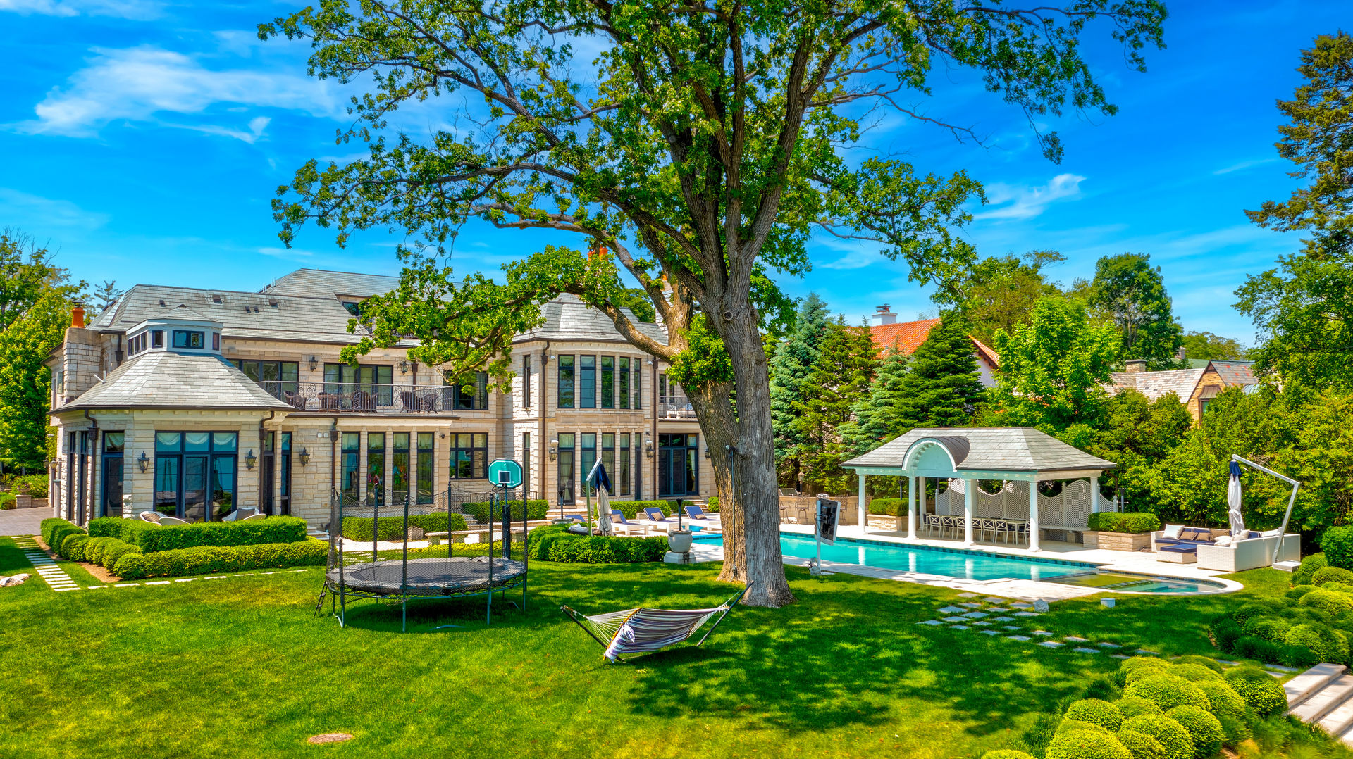 319 Sheridan Road Winnetka, IL 60093 - Photo 6 of 15 a front view of a house with garden