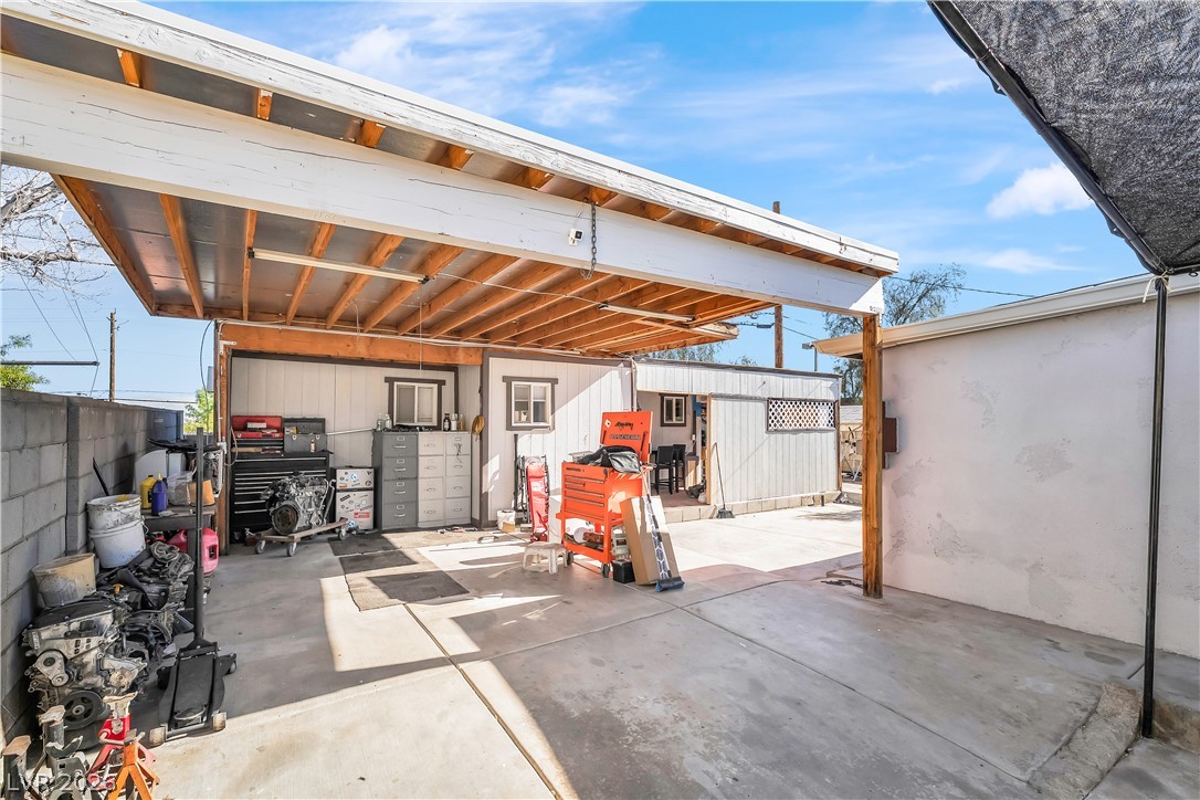 140 West Victory Road Henderson, NV 89015 - Photo 20 of 24 A versatile covered outdoor area provides ample workspace or protected parking for your convenience.