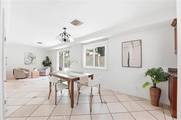 a view of a livingroom with furniture and a table