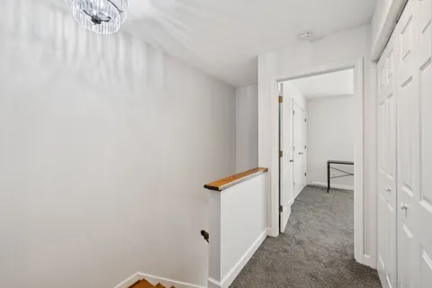 a bedroom with a bed dresser and a window