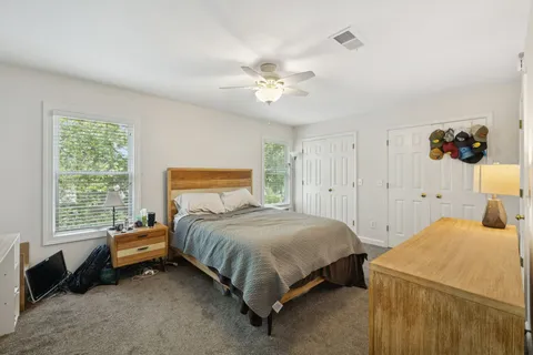 a bedroom with bed and tv