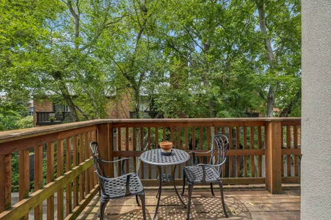 a view of balcony with furniture