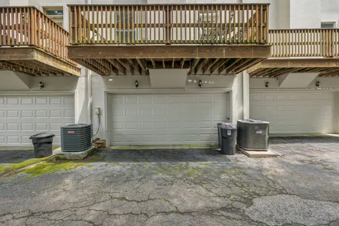 a view of a garage with wooden fence