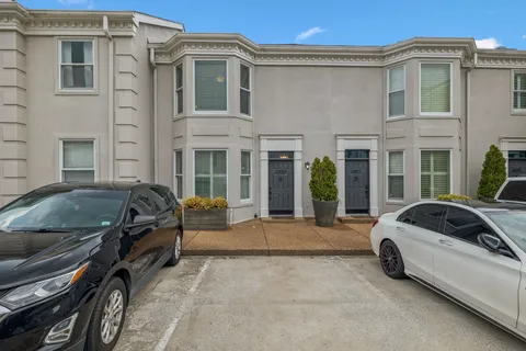 a view of a car parked in front of a building