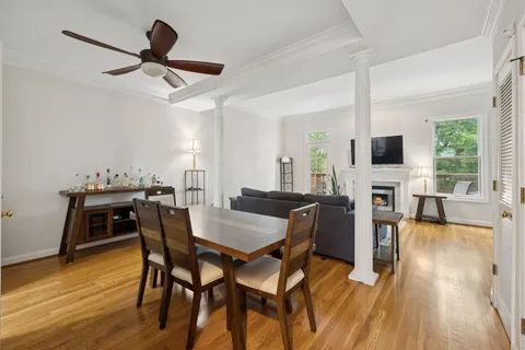 a view of a dining room with furniture window and wooden floor