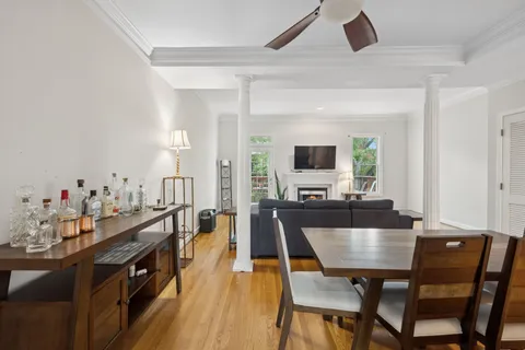 a view of a dining room with furniture and wooden floor