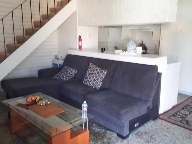 a living room with furniture and a table