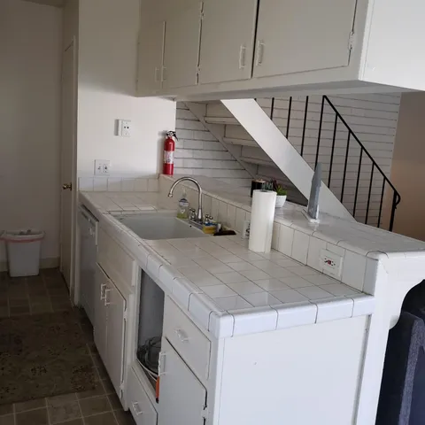 a kitchen with a sink and cabinets