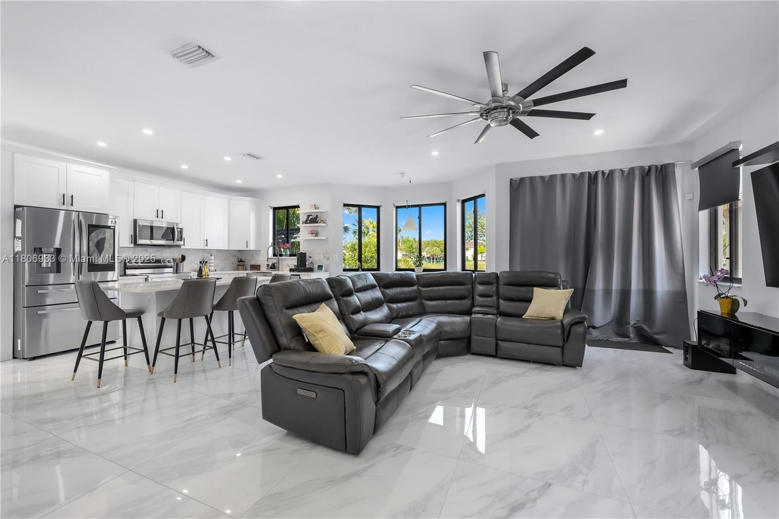 1857 Southeast 20th Road Homestead, FL 33035 - Photo 11 of 31 a living room with lots of furniture and a large window