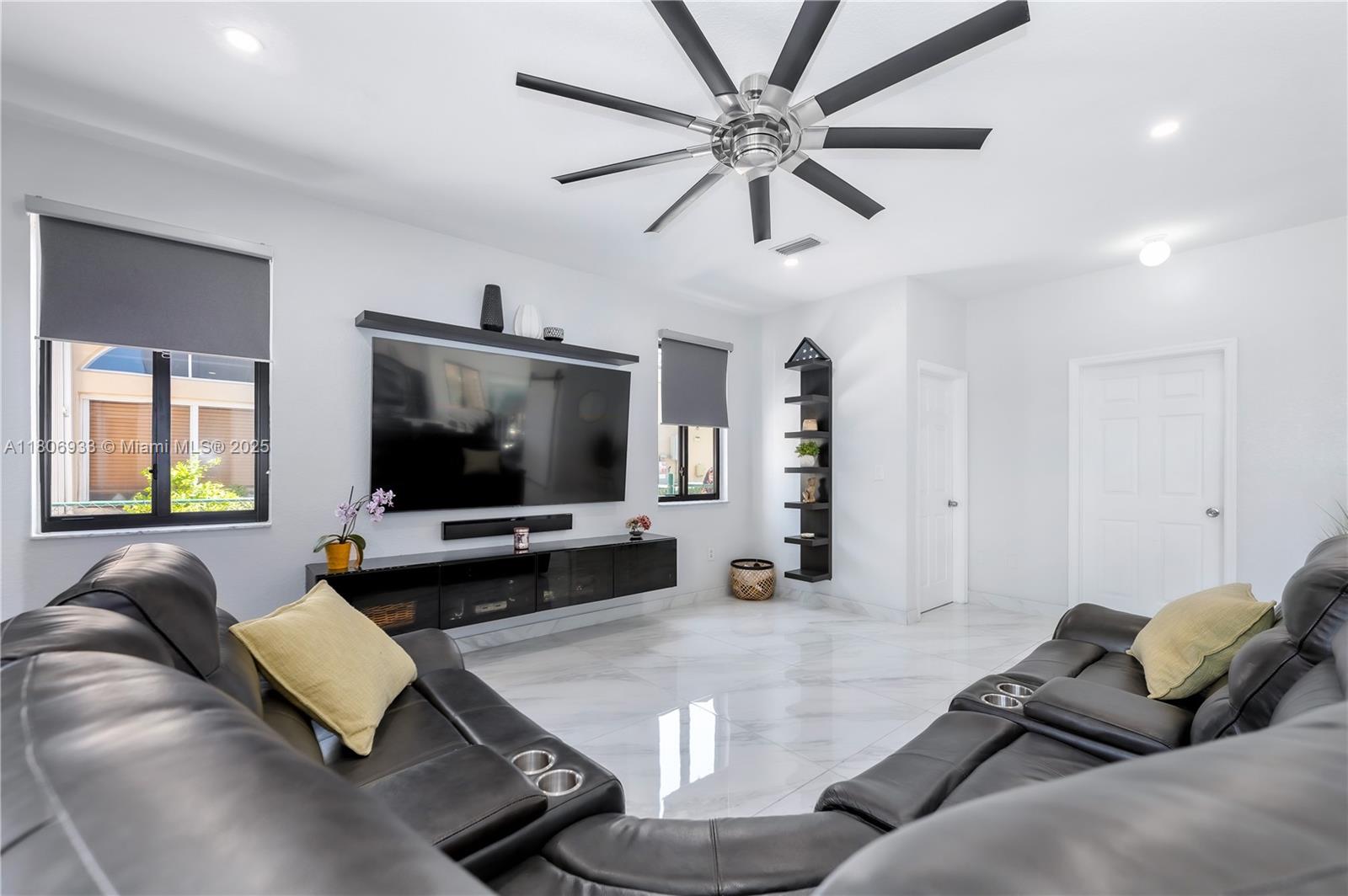 1857 Southeast 20th Road Homestead, FL 33035 - Photo 12 of 31 a living room with furniture and a flat screen tv