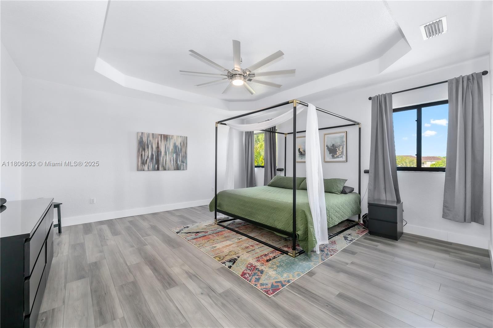 1857 Southeast 20th Road Homestead, FL 33035 - Photo 14 of 31 a bedroom with a bed and a mirror