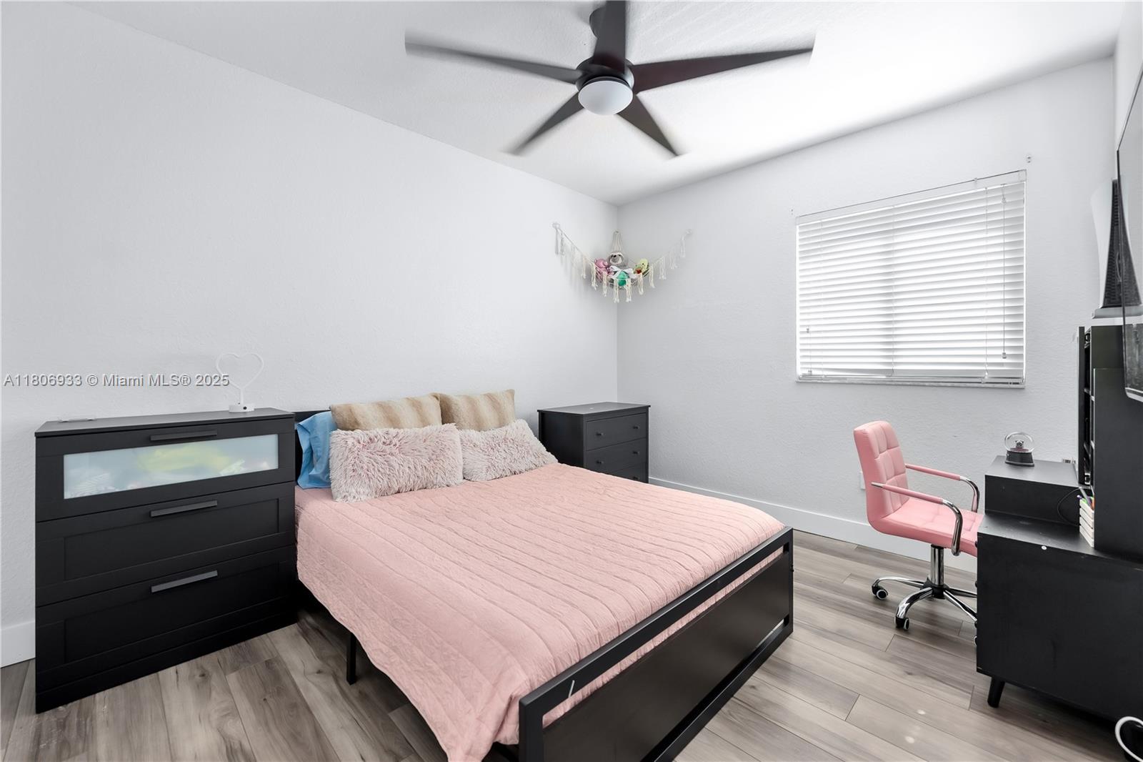 1857 Southeast 20th Road Homestead, FL 33035 - Photo 18 of 31 a bedroom with a bed and a table