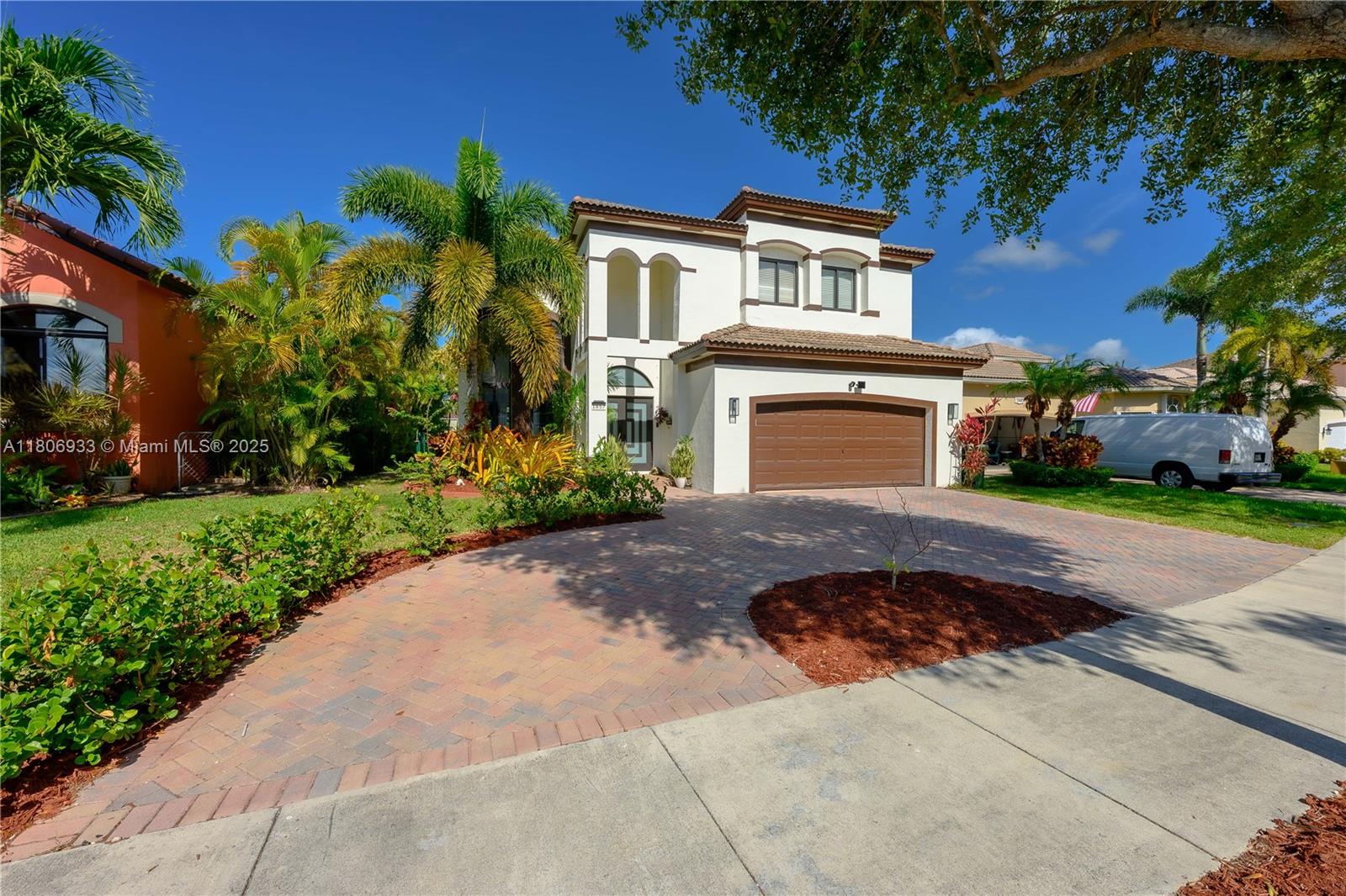 1857 Southeast 20th Road Homestead, FL 33035 - Photo 23 of 31 a front view of a house with a yard and garage