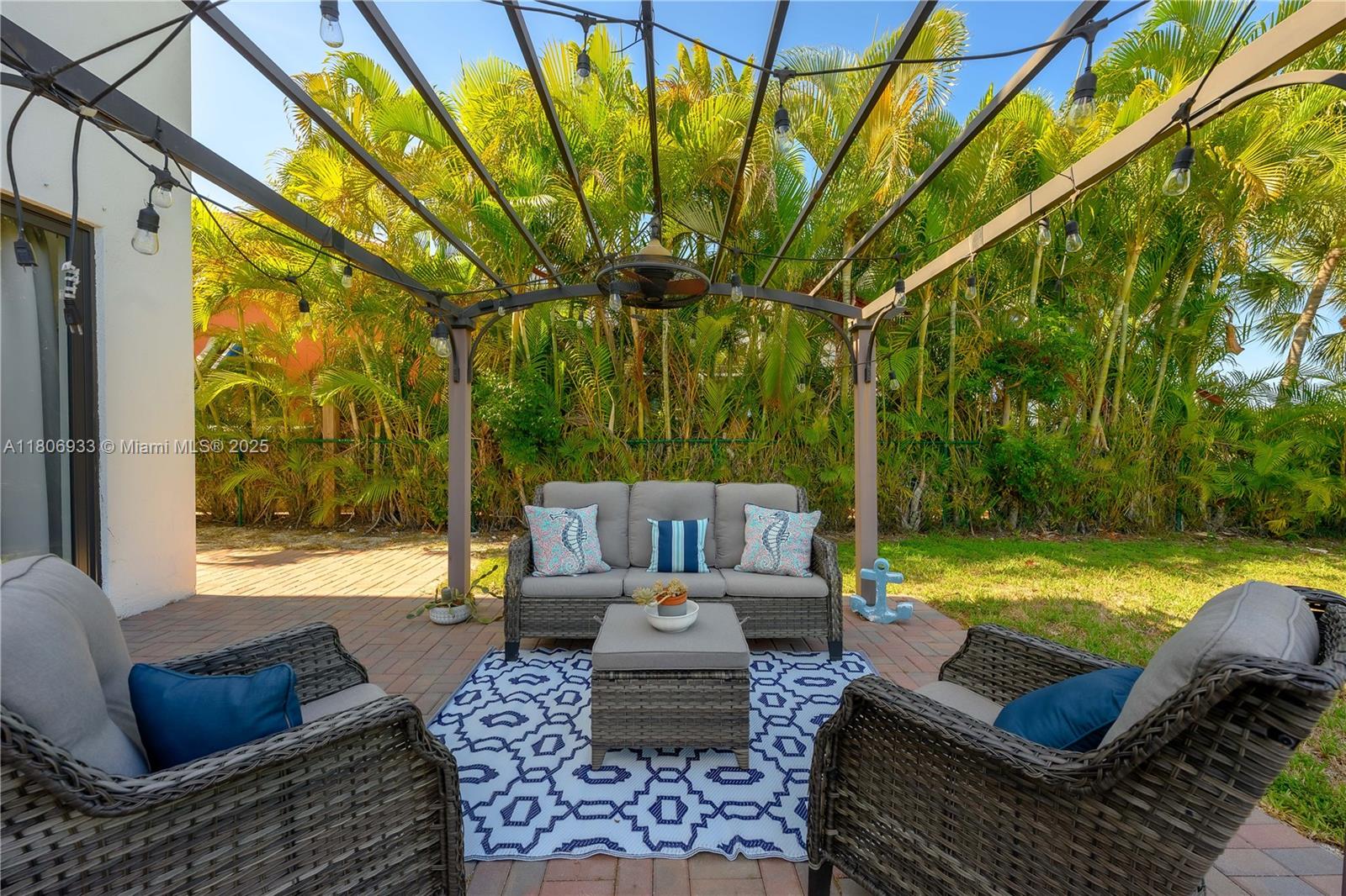1857 Southeast 20th Road Homestead, FL 33035 - Photo 29 of 31 a view of a patio with couches chairs and a table with garden view
