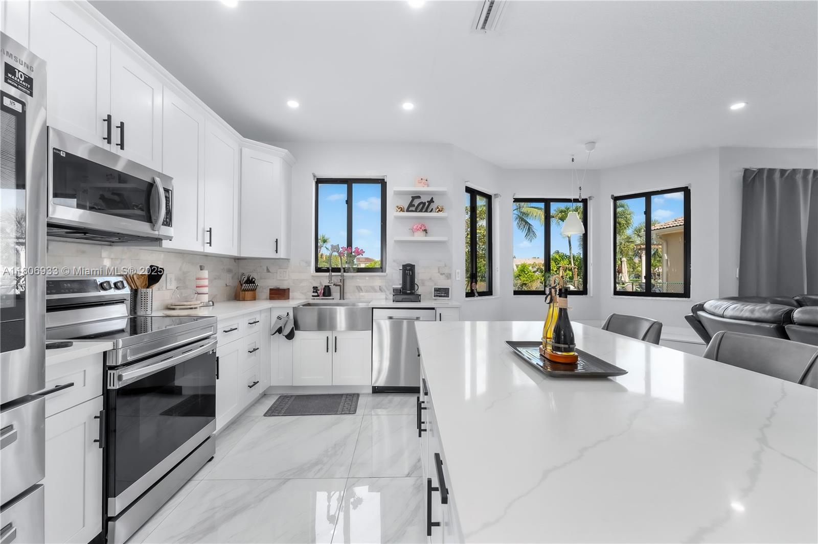 1857 Southeast 20th Road Homestead, FL 33035 - Photo 10 of 31 a kitchen with counter top space cabinets and stainless steel appliances
