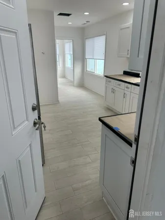 a kitchen with stainless steel appliances granite countertop a refrigerator and a stove