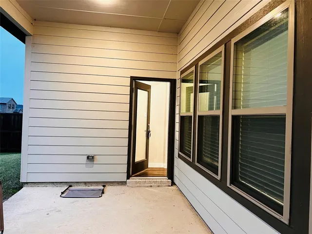 a view of a door and a window