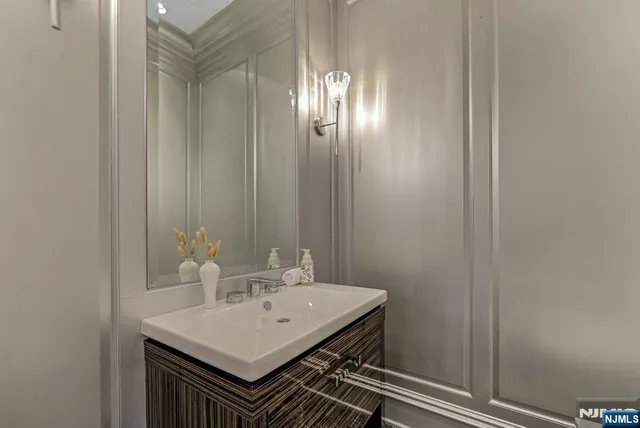 a very nice looking dining room with a large dining table and chairs