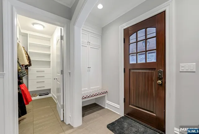 a en suite bathroom with a double vanity sink and a window