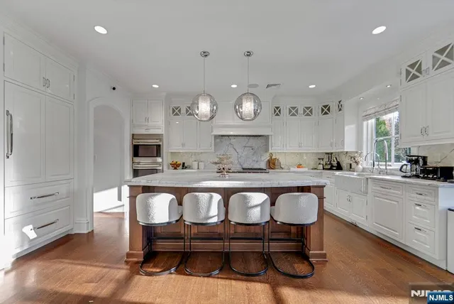 a kitchen with stove and cabinets