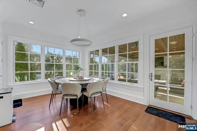 a view of staircase with white walls and a window